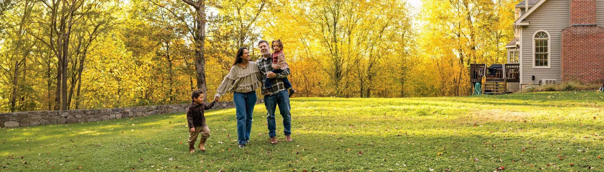 Happy family outside their Colorado home.
